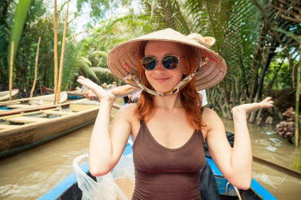Boat trip though coconut forest at Mekong Delta