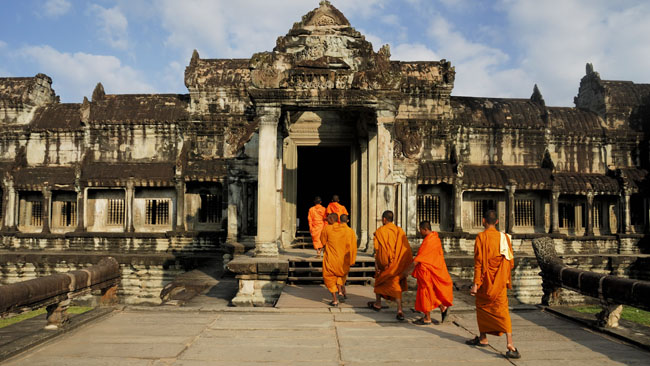 Monks walking into the Angkor Wat Temple -- Vietnam Cambodia 12 Days Highlights Tour