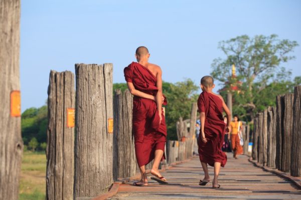 Monks from local Buddhist temple in Amarapura crossing U Bein bridge